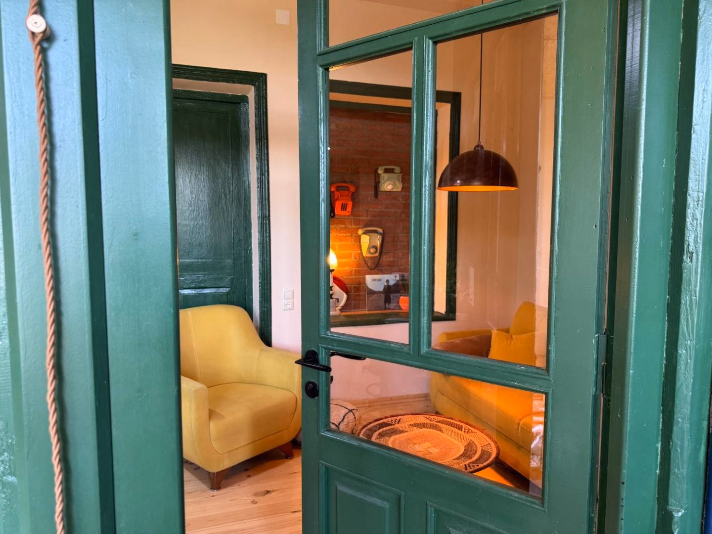 The green painted door of the sitting room at Our Old House in Telavi